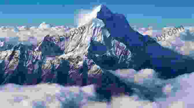 A Breathtaking Image Of Mount Everest, Its Snow Capped Peak Piercing Through The Clouds. The Everest Years: The Challenge Of The World S Highest Mountain