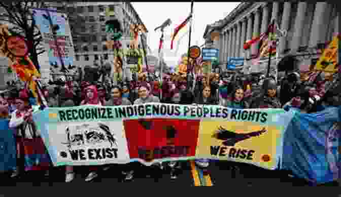 A Group Of Native American Protesters Holding Signs Demanding Justice This Land: How Cowboys Capitalism And Corruption Are Ruining The American West